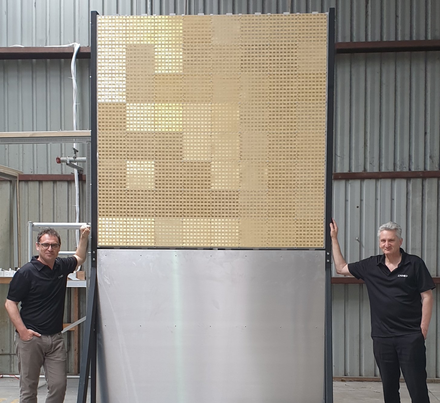 Greg Kushnir + Dr. Ray Simpkin next to EMROD's first indoor demonstration system, Auckland, New Zealand, 2021